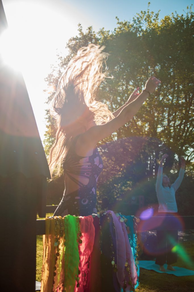 An image representing mindful movement and embodied awareness, showing a person moving with strength, balance, and freedom in a calm natural setting. The scene reflects a holistic approach to physical health, emotional wellbeing, mental clarity, and creative expression through conscious movement practices tailored to the individual body.